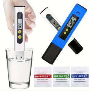 Digital TDS meter testing water purity with color-coded results.