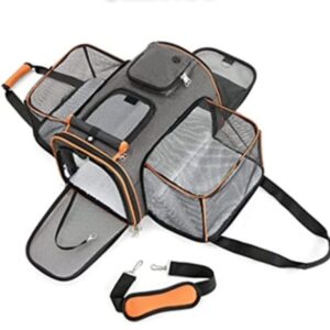Portable pet carrier bag with mesh panels and shoulder strap.