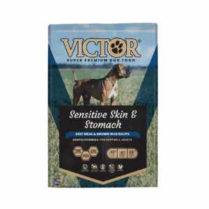 Victor Sensitive Skin & Stomach dog food pouch on wooden surface.