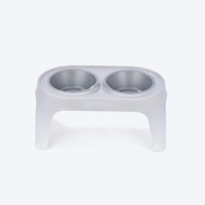 White elevated double pet feeding bowl stand with two stainless steel bowls.